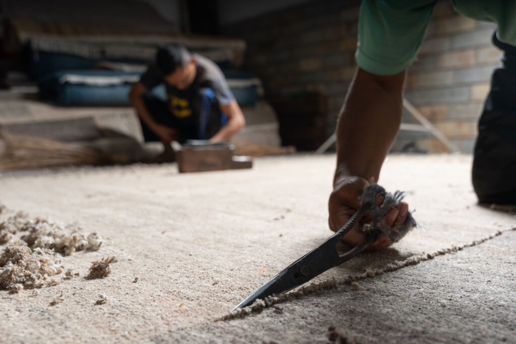 NP Rugs artisan production floor Boudha Kathmandu Nepal ethical manufacturing