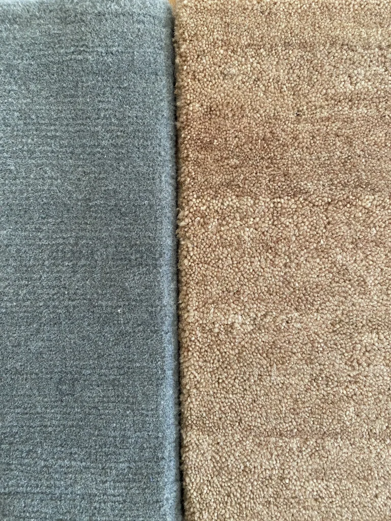 Side by side comparison of Himalayan wool and New Zealand wool rug pile close-up